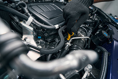 auto-repair-professional-checking-oil-level-with-d-2021-09-07-21-01-16-utc (1)